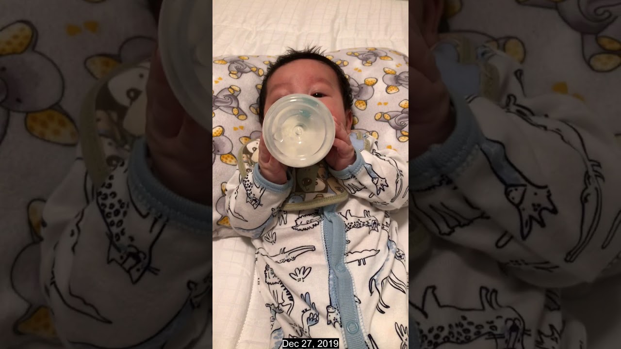 Two months old baby holding his bottle in his own YouTube