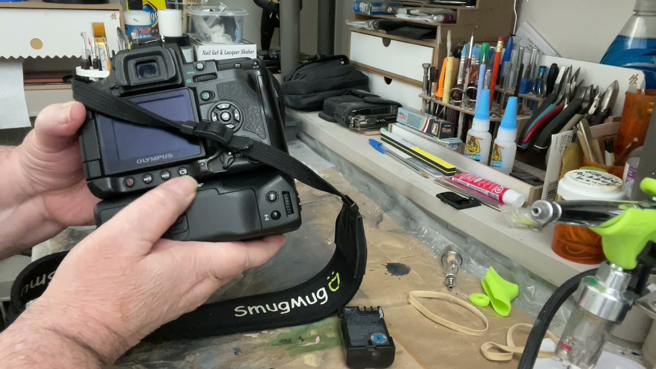 How to install a HLD 4 battery grip on a Olympus E 3 - YouTube