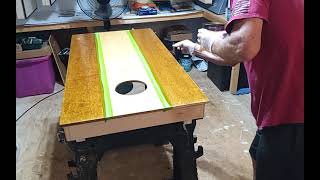 Staining a cornhole board