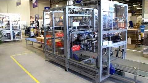 Lantech LA 1000 Lid Applicator Video With Stacking Edge Closer at infeed