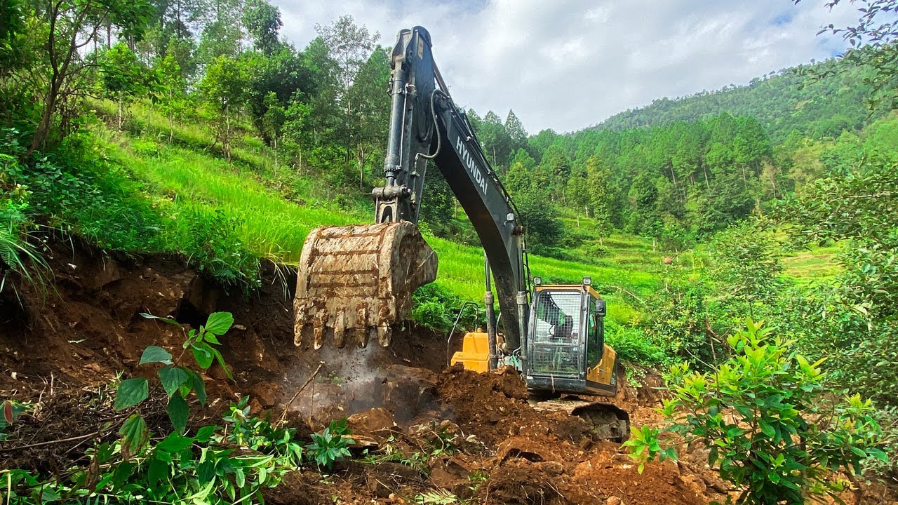 Excavator Operator Carves a Road on a Sheer Jungle Cliff | Excavator Planet