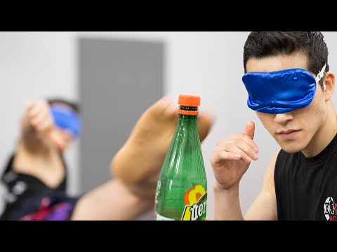 Fighting Instructor Tries The Bottle Cap Challenge