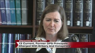 13 current, former DPS principals charged with bribery and conspiracy