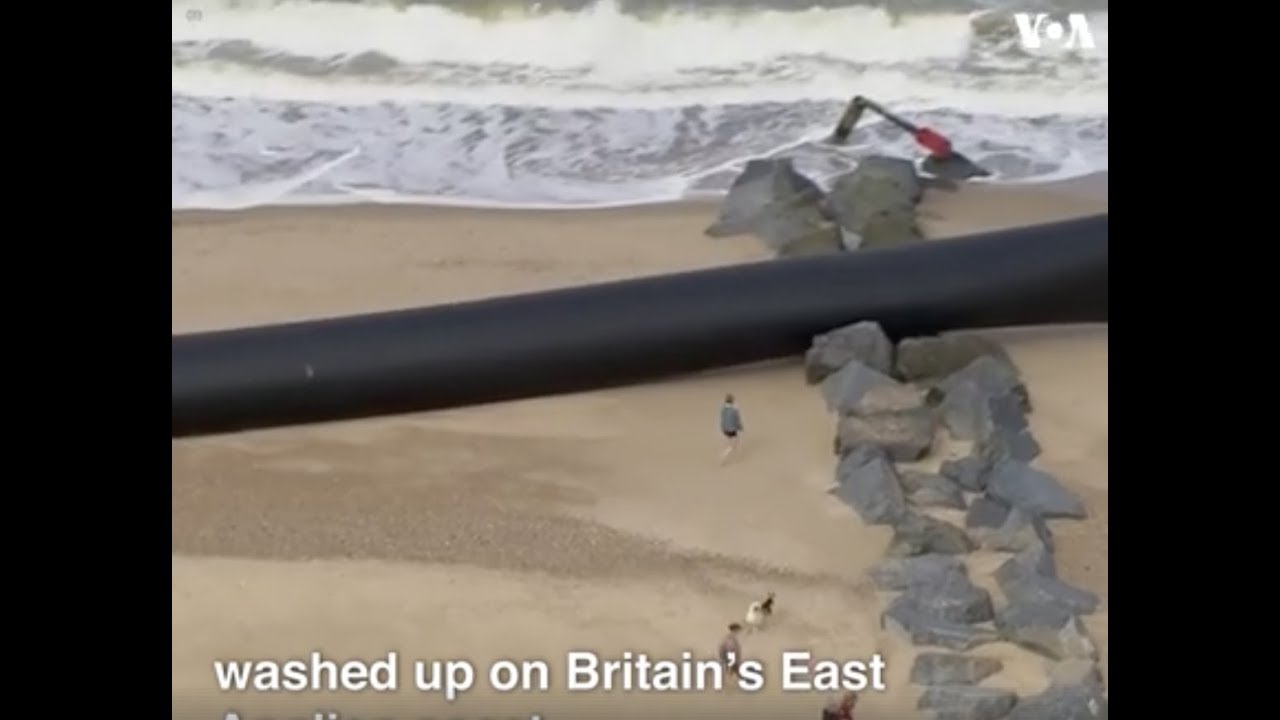 Giant plastic pipes washed up on a beach in England