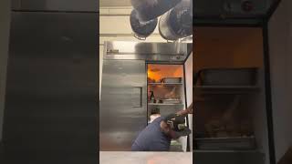 Gasket installation on a True Refrigerator.