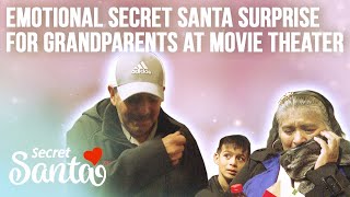 School custodians who lost everything in a fire get emotional Secret Santa surprise at movie theater