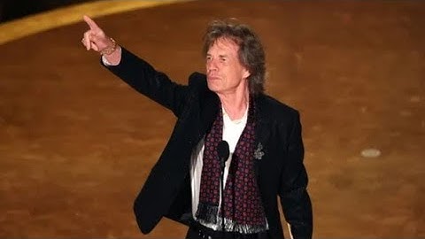 Surprise Oscars guest Mick Jagger says he replaced Bob Dylan to present Best Original Song