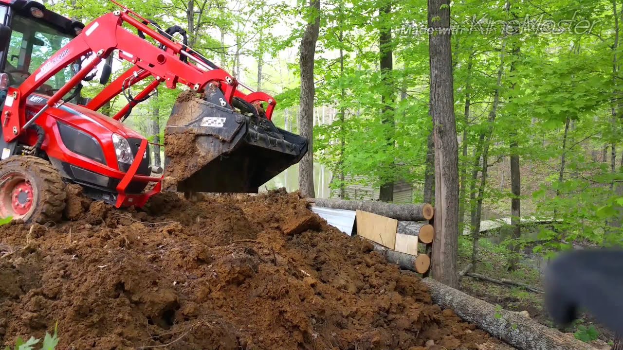 Kioti NX6010 cutting, digging hill & filling retaining wall