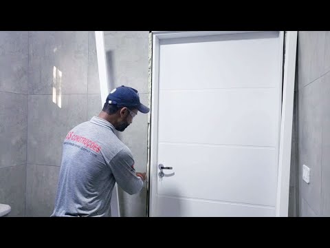 Vídeo: Como instalar uma porta com suas próprias mãos: instruções passo a passo