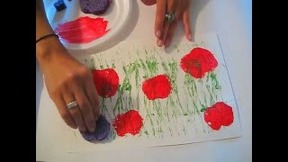 Use a string glued onto a paper towel roll or a flat water bottle to create a green field for poppies cut from sponges and printed onto 