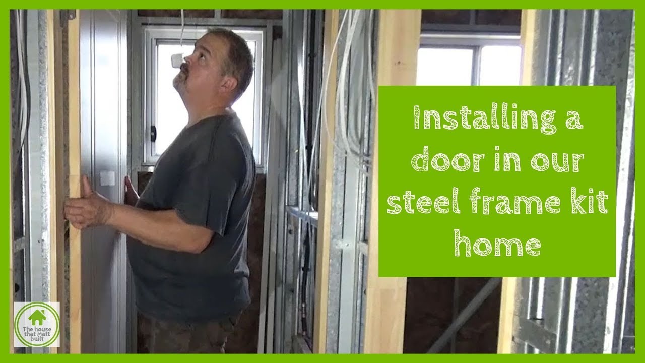 Installing the doors in our steel frame Paal kit home - YouTube