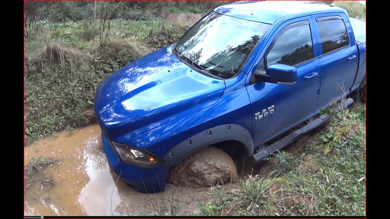 Dodge Ram 1500 stuck in mud/crew cab 6`4" box 4" lift/ Radilo - YouTube