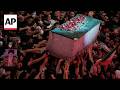 Mourners cry and push toward coffin of Iran’s late supreme leader in Iraq