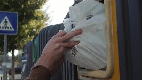 Placing Rubbish Into Bin Stock Video