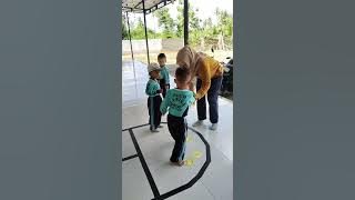 Modification of the traditional game of hopscotch, into a game to learn numbers and letters.