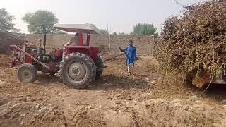tractor stuck in mud with trolley