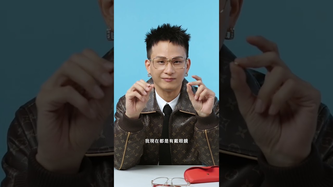黃奇斌舞台上的標配金框眼鏡+耳環 縮圖