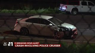 Colorado Springs police officer with minor injuries after car crashes into back of patrol car on...