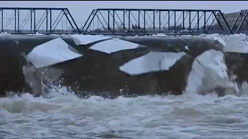 Mesmerizing sheets of ice break over Grand River waterfall