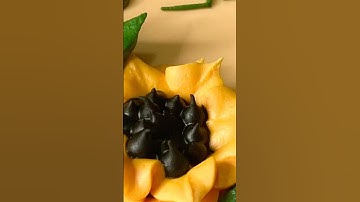 Super easy royal icing sunflowers for cookies or cakes!  Tips used: Wilton round 2 & 7, Wilton 352.