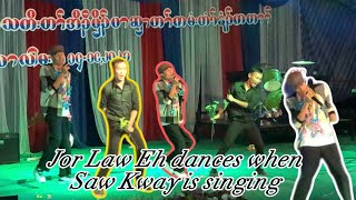 Jor Law Eh dances when Saw Kway is singing on the stage at Mae La Camp. They sing and dance together