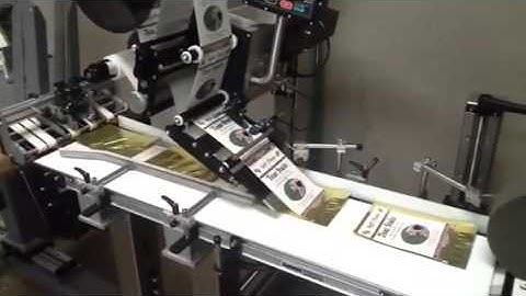 Top bottom pouch labeler with feeder