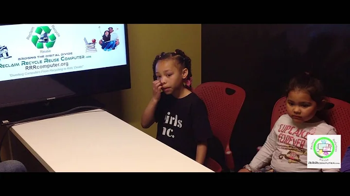 2 kids receiving computer from RRRcomputer.org