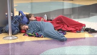 Passengers stranded as more than 6,000 flights cancelled
