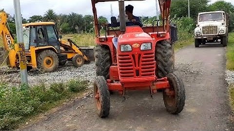Mahindra yuvo tractor pulling fully loaded trolley on railway track | Jcb 3dx machine