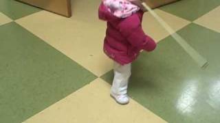 Toddler who is blind  uses cane to navigate and learn  her world