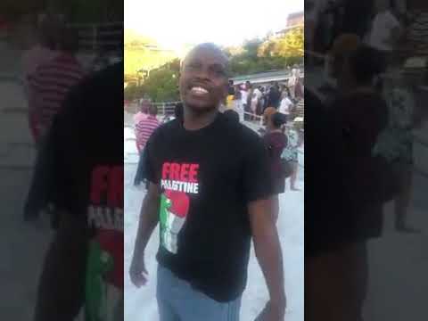 Black protesters on Clifton beach calling the existence of whites "racist"
