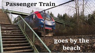 Amtrak train ZOOMS on the tracks by THE BEACH