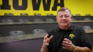 University of Iowa Distinguished Alumni Awards 2024 | John Kundel | Forevermore Staff Award
With a career that began and ended at the University of Iowa, John Kundel has acted with a spirit of service in everything he does. The inspiring higher education professional helped hundreds of students achieve their college dreams while lifting the morale of the teams he led with positivity and a rally cry of “Good hustle!”
After completing his degree and U.S. Army deployment to Vietnam, Kundel returned to Iowa City to work in the UI Office of Student Financial Aid while pursuing a master’s degree. In 1984, he departed Iowa and rose through the ranks of financial aid, admissions, and enrollment departments at three other Midwestern universities.
After retiring from the University of Missouri as associate vice provost for student affairs and enrollment management in 2007, Kundel volunteered for the University of Iowa as an alumnus admissions representative, attending college fairs to help St. Louis-area students see the value in an Iowa education. From 2016 to 2024, Kundel worked as a regional admissions counselor in the St. Louis area for the UI.
Kundel received a Combat Infantryman Badge and an Army Commendation Medal with “V” device for valor for his active duty in Vietnam. He continued serving 20 years in the Army Reserve, including roles as a battalion commander and assistant professor of military science at Western Michigan University. Kundel also contributed many hours to youth sports, Veterans of Foreign Wars, American Legion, and advisory councils and committees on and off campus.
With 50 years of unflagging enthusiasm for higher education, and especially Iowa, Kundel has made a lasting impact on so many students in Iowa City and beyond. University of Iowa Distinguished Alumni Awards 2024 | John Kundel | Forevermore Staff Award
