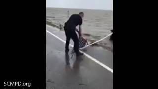 Police officer rescues flag after Hurricane Irma