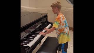 9 Year old plays motley crue on piano in Von Maur!