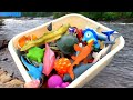 Box of Sea Animal Toys near a River