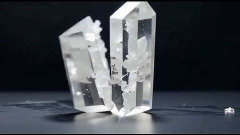 Super-sharp knife slices real minerals: obsidian, quartz, jade in perfect slow-motion realism.