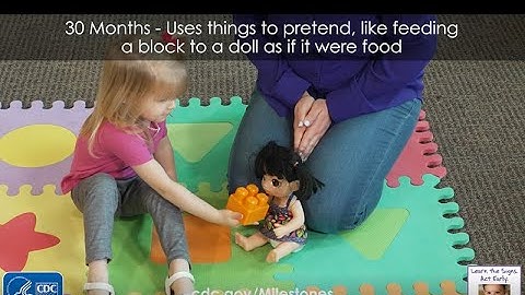 30 Months – Uses things to pretend, like feeding a block to a doll as if it were food