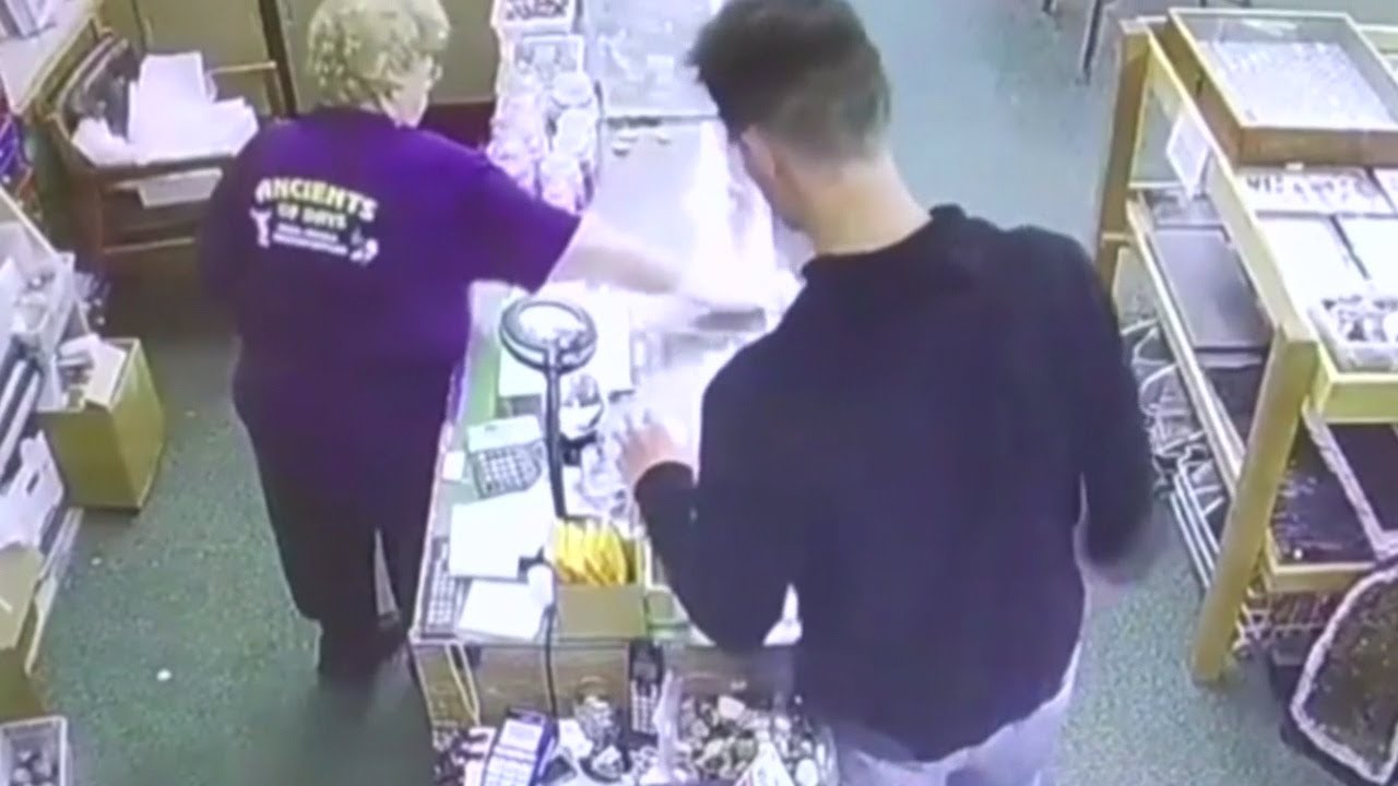 Thief caught on camera taking money from donation jar - YouTube