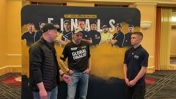 Cat Global Operator Challenge finalist Sebastian Behr of Germany talks to Lucas Haddock