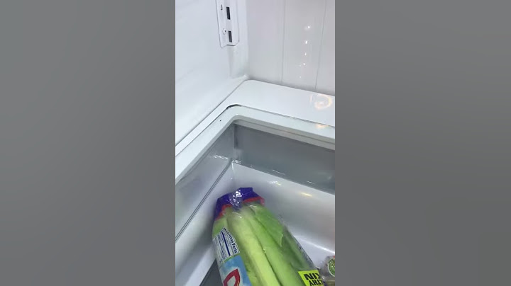Bottom glass shelf of fridge slides into place with a clunk