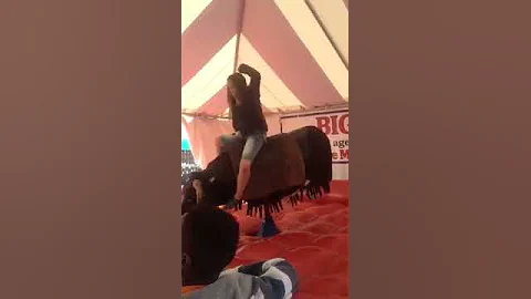 Elizabeth Collier riding a bull