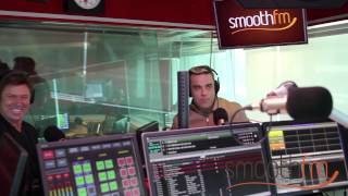 Robbie Williams surprises a fan on air