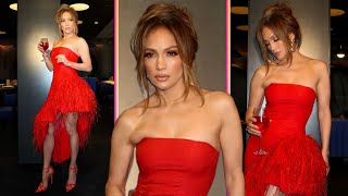 Jennifer Lopez Stuns in Feather-Trimmed Red Dress, Promotes Delola Cocktail Line