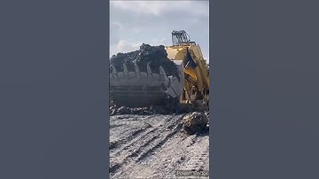 Largest excavator unloading in reverse#viral#youtube shorts#trucks#go down deh song#jcb