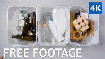 FREE 4K VIDEO - Mixed Recycling Glass and Plastics In Different Bins