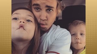 The 21-year-old musician's dad shared a sweet video on vine of
bieber's half-brother and half-sister singing his first big hit.