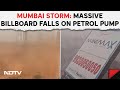 Mumbai storm news  dust storm causes chaos in mumbai massive billboard falls on petrol pump