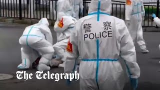 video: Shanghai police 'beat elderly and women' as homes are seized for Covid quarantine