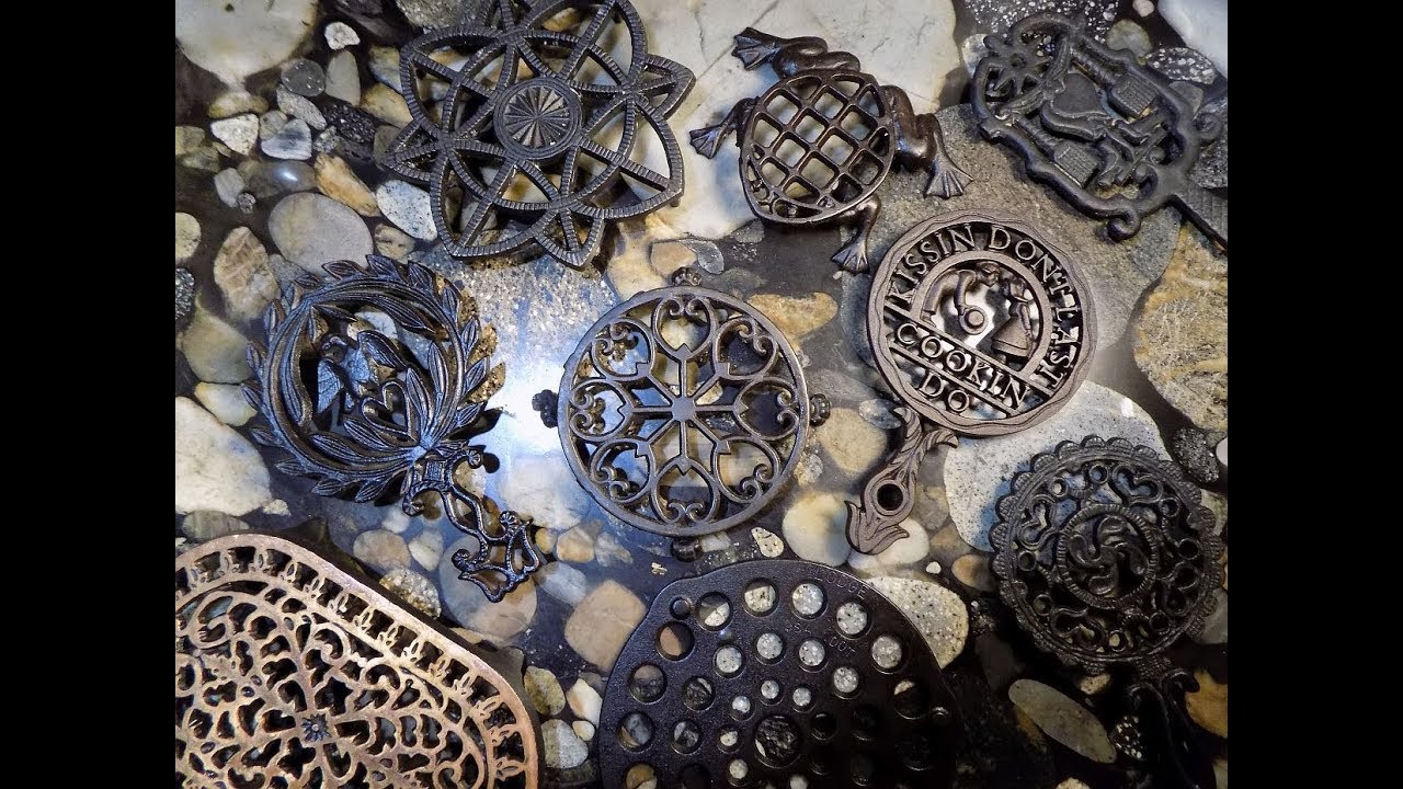 A Small Collection of Cast Iron Trivets 